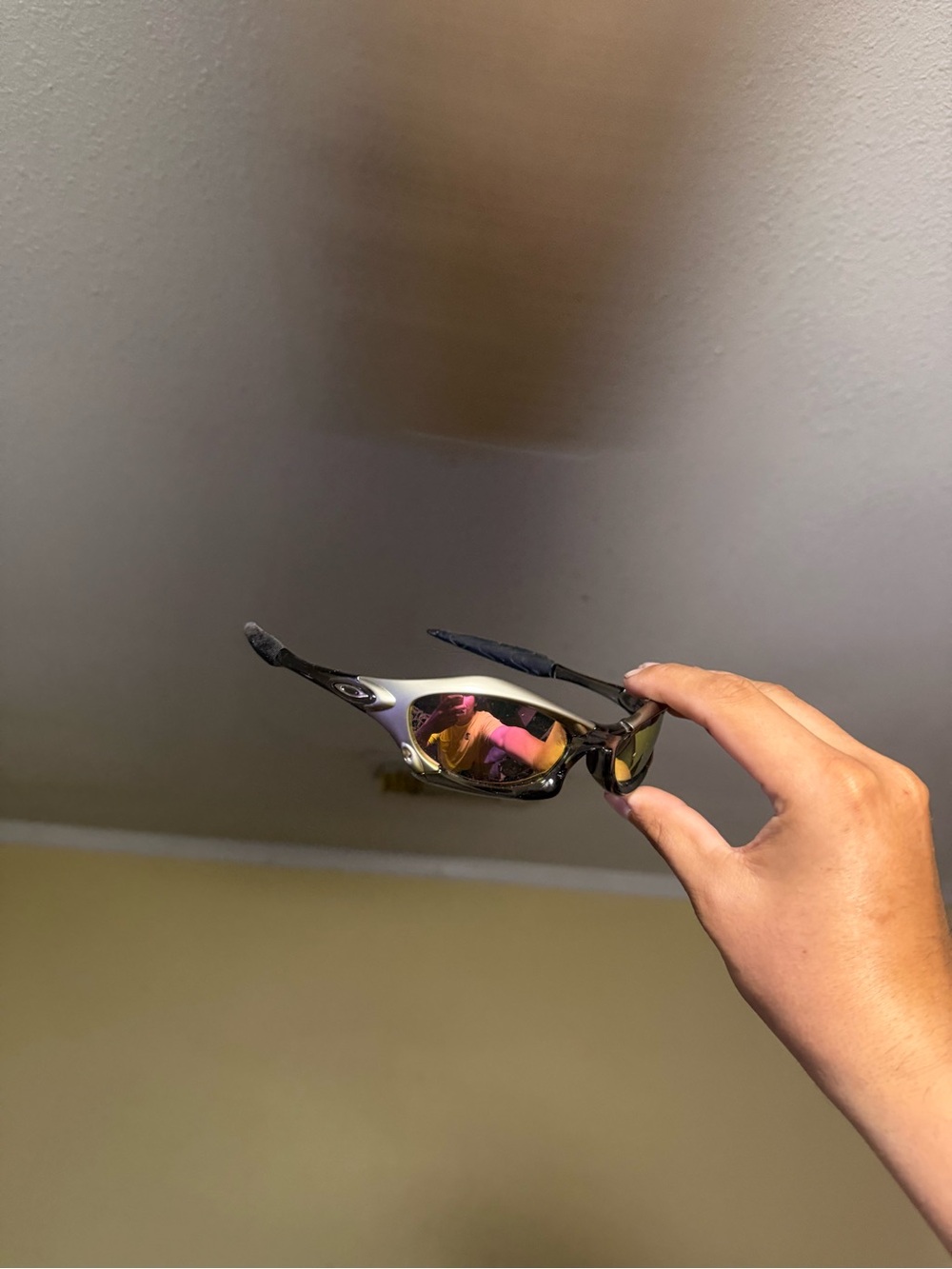 Oakley Black Frame Sunglasses with Pink Mirror Lenses